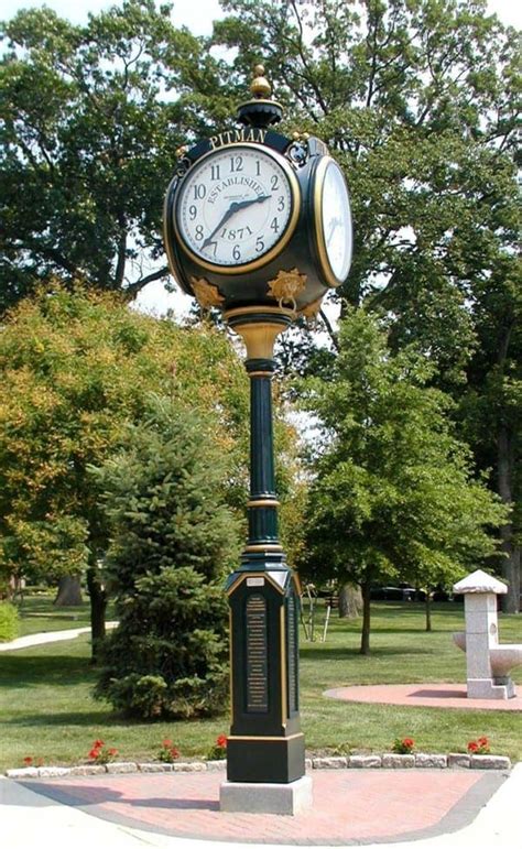 outdoor clocks on post stands.